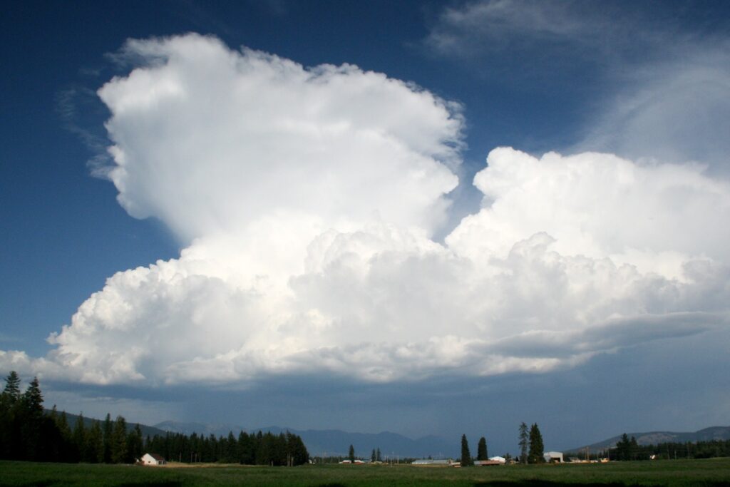 Large cumulonimbus cloud with dark rain clouds beneath.