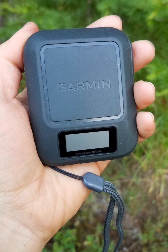 Garmin Inreach Messenger in a hand.